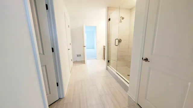 a view of a bathroom from the hallway