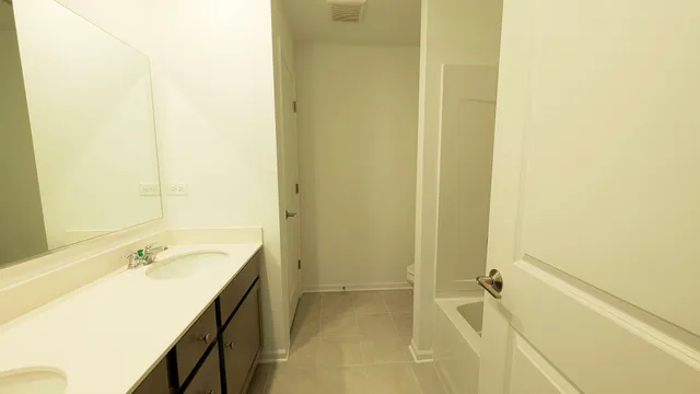 a bathroom with a sink and a bathtub