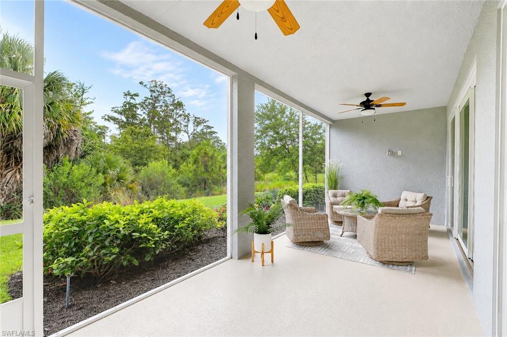 2620 Seychelles Circle, Unit 1302 Naples, FL 34112 - Photo 22 of 43 a living room with furniture and a potted plant
