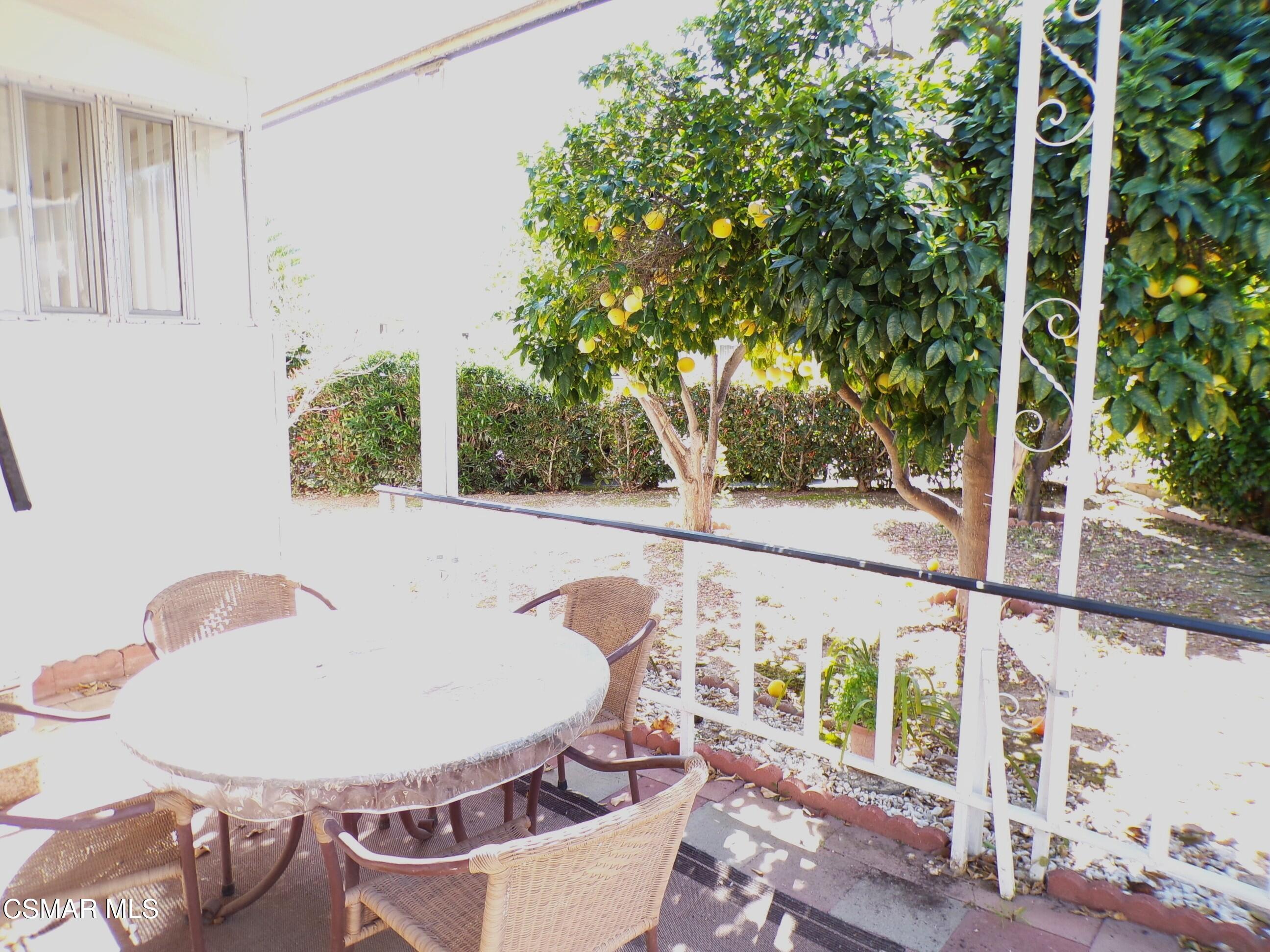 250 East Telegraph Road, Unit 220 Fillmore, CA 93015 - Photo 24 of 24 a view of a balcony dining table and chairs