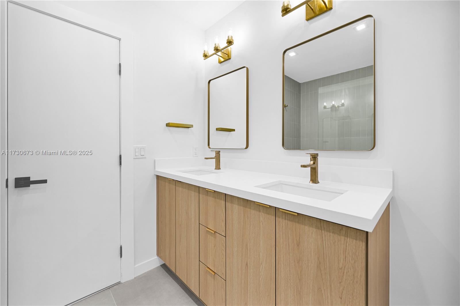 8745 Southwest 175th Street Palmetto Bay, FL 33157 - Photo 18 of 37 a bathroom with a sink and a mirror