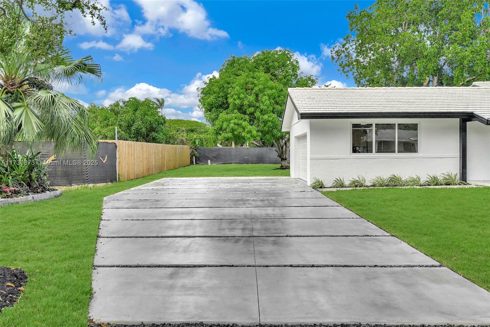 8745 Southwest 175th Street Palmetto Bay, FL 33157 - Photo 25 of 37 a view of outdoor space yard and front view of a house