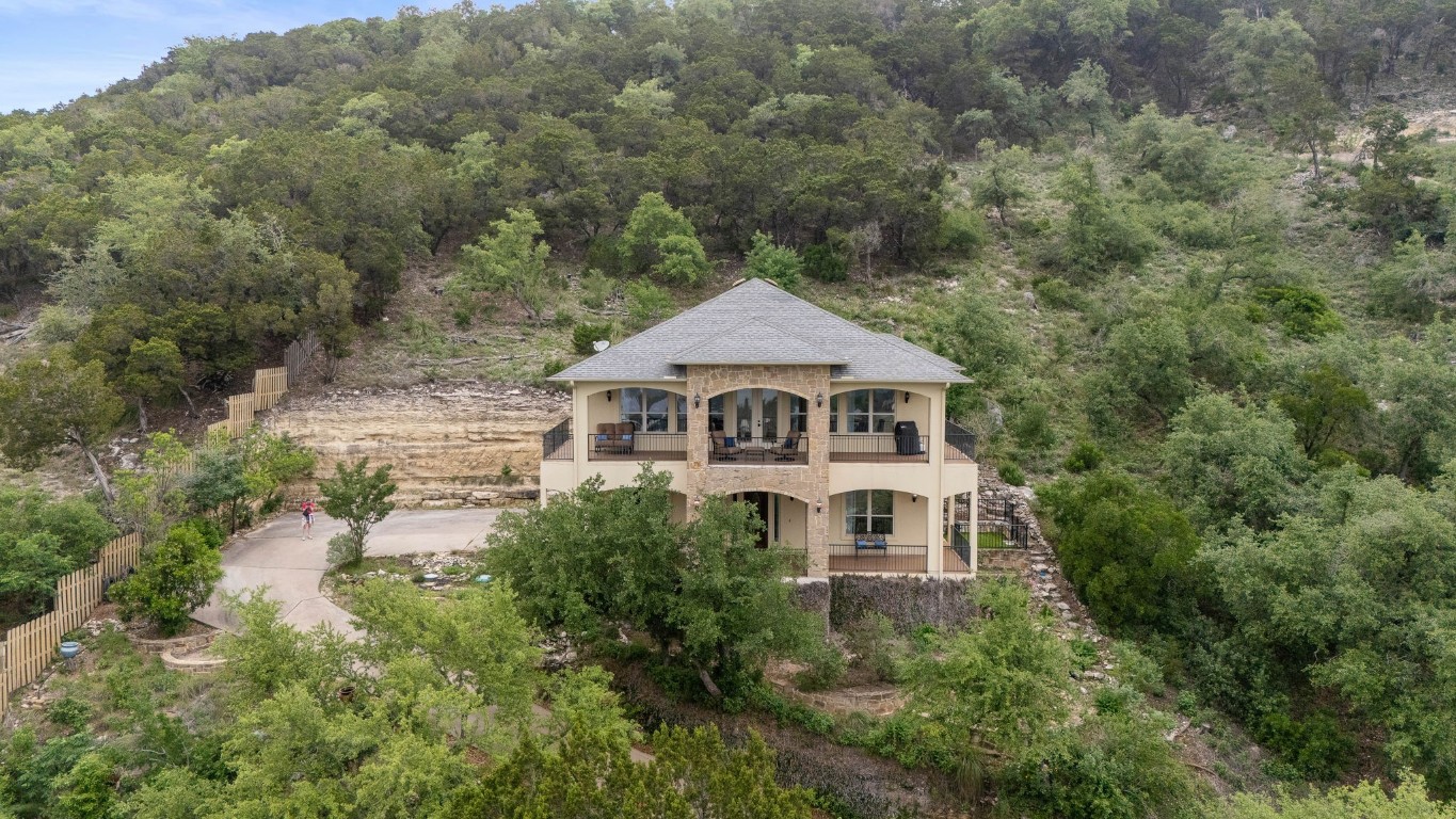 Sitting high upon a hill with Lake Travis and Hill Country views!