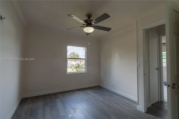a view of an empty room with a window