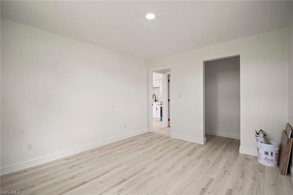 2316 Bayside Street Naples, FL 34112 - Photo 16 of 24 wooden floor in an empty room