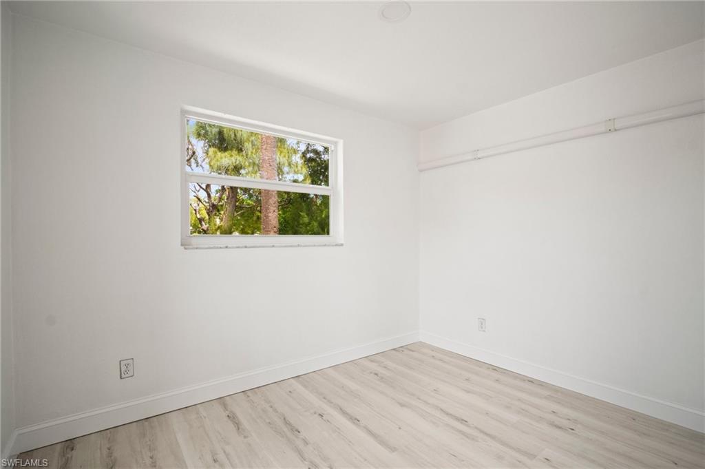 2316 Bayside Street Naples, FL 34112 - Photo 17 of 24 an empty room with a window
