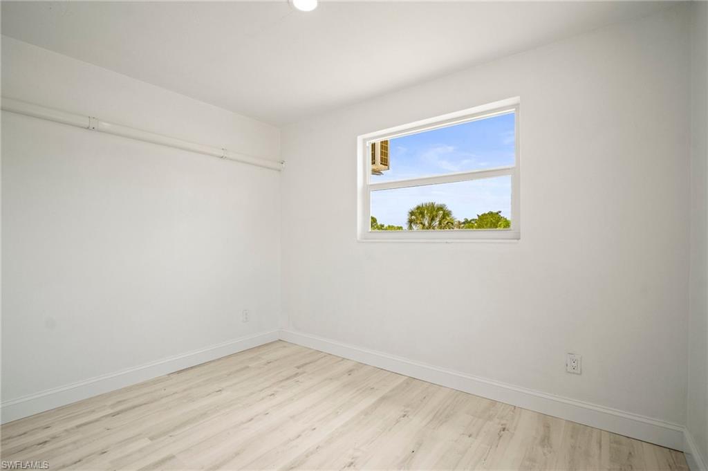 2316 Bayside Street Naples, FL 34112 - Photo 21 of 24 a view of an empty room with a window