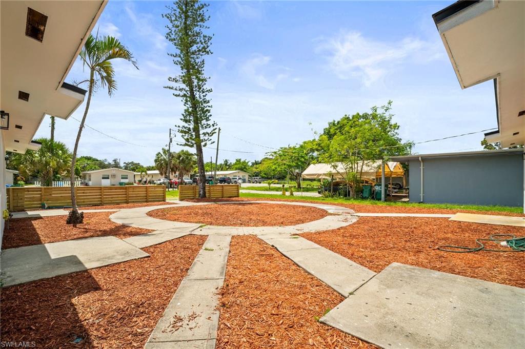 2316 Bayside Street Naples, FL 34112 - Photo 4 of 24 a view of a backyard with a patio