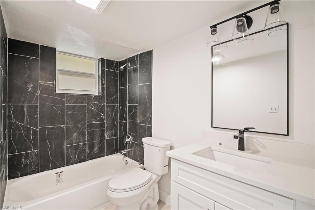 2316 Bayside Street Naples, FL 34112 - Photo 8 of 24 a bathroom with a sink toilet and shower