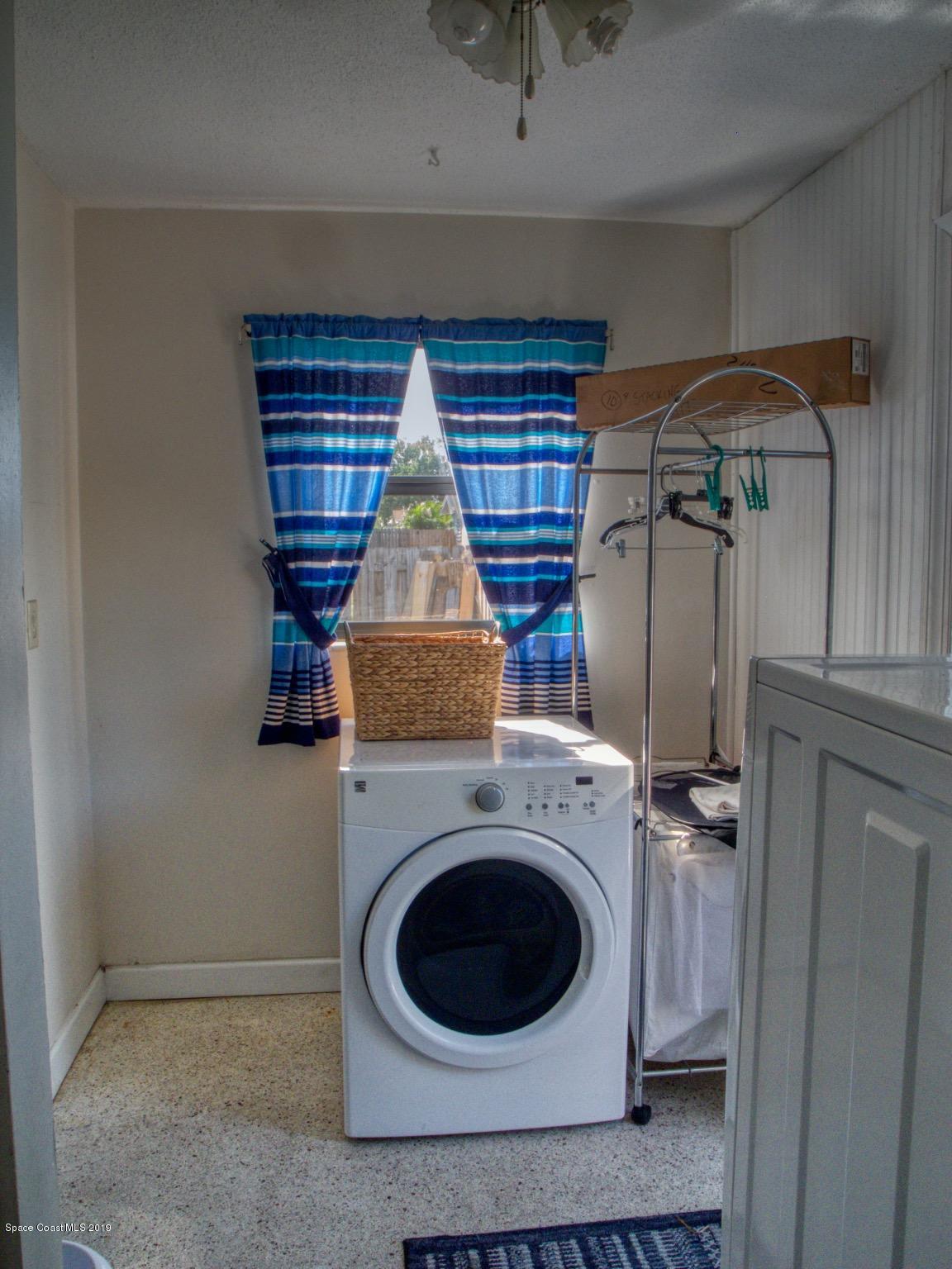 2268 Woodbury Road Melbourne, FL 32935 - Photo 15 of 20 LAUNDRY ROOM W/DOOR TO BACK YARD