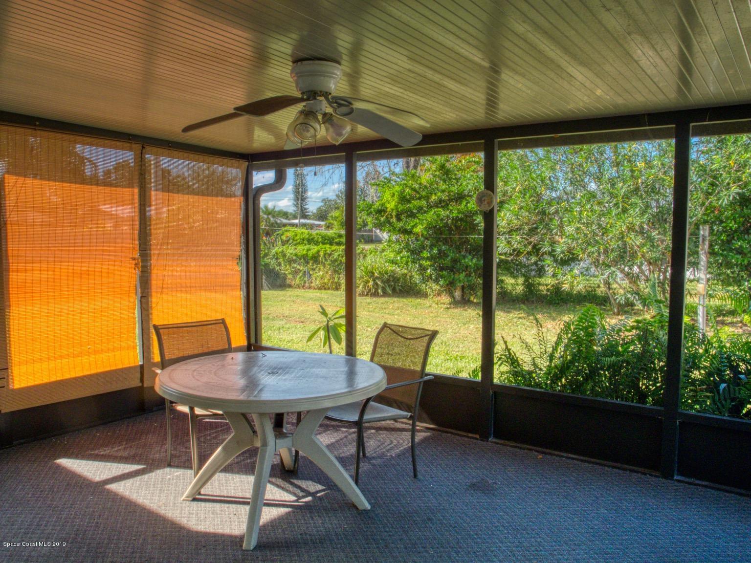 2268 Woodbury Road Melbourne, FL 32935 - Photo 16 of 20 ENCLOSED PATIO/PORCH