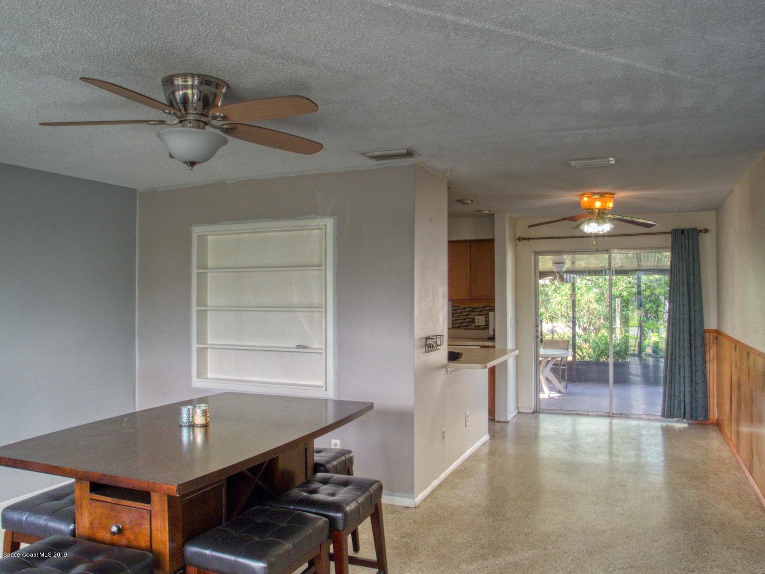 2268 Woodbury Road Melbourne, FL 32935 - Photo 6 of 20 DINING ROOM W/SLIDING GLASS DOORS