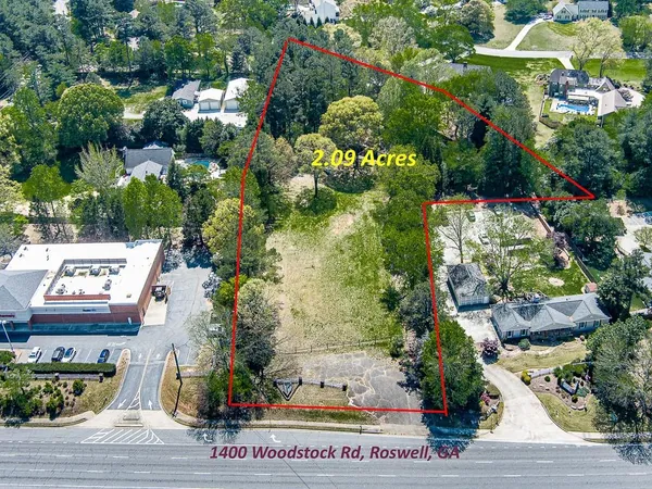 an aerial view of houses with yard