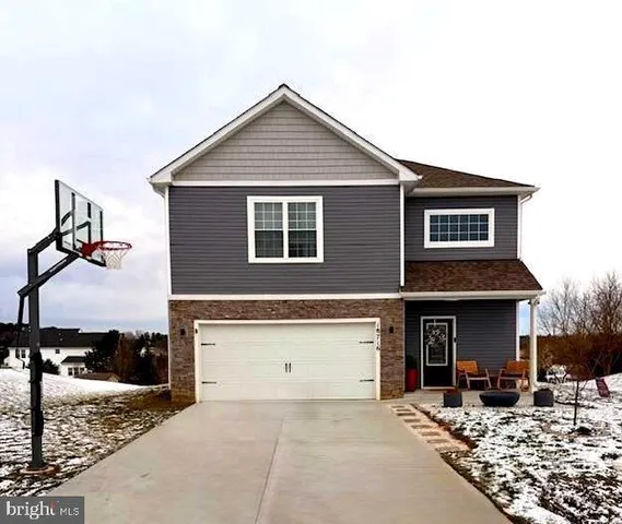 a front view of a house with yard