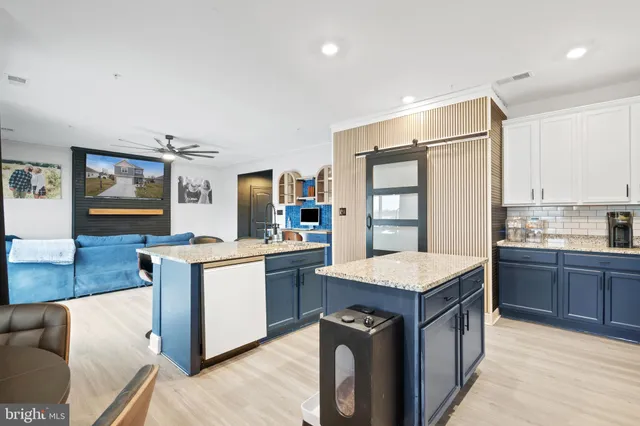 a kitchen with granite countertop a stove oven and sink