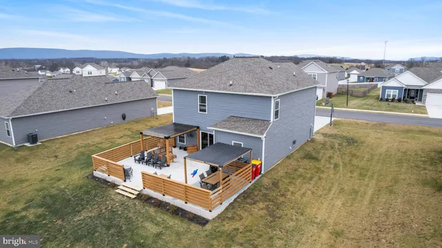 an aerial view of a house with a big yard