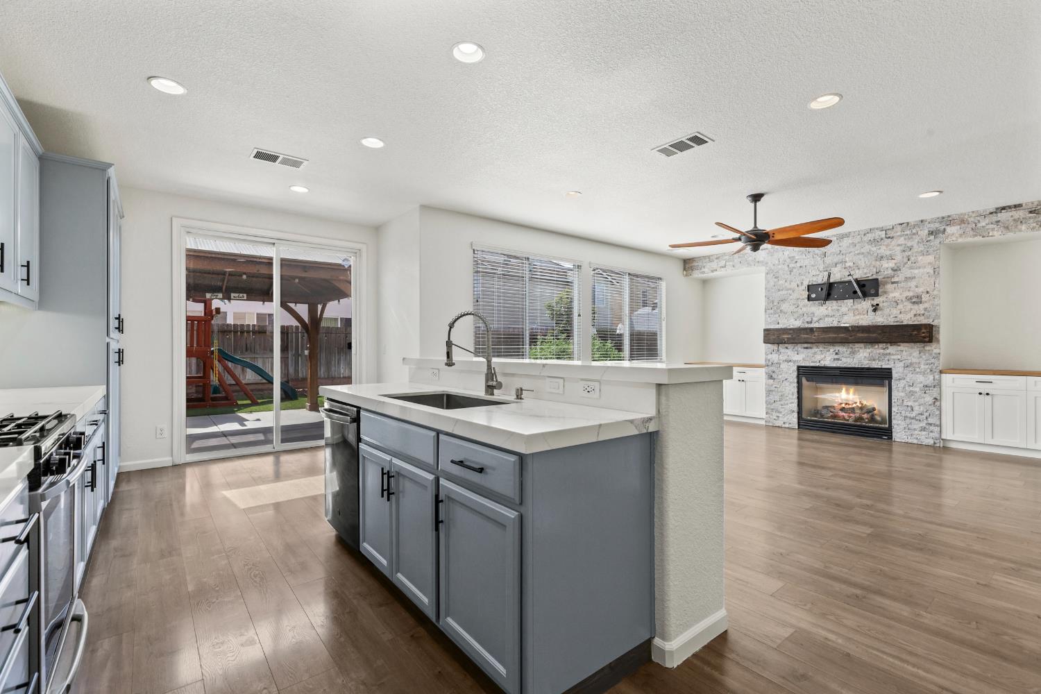 2836 Tabriz Drive Modesto, CA 95355 - Photo 12 of 35 a kitchen with a stove and a sink