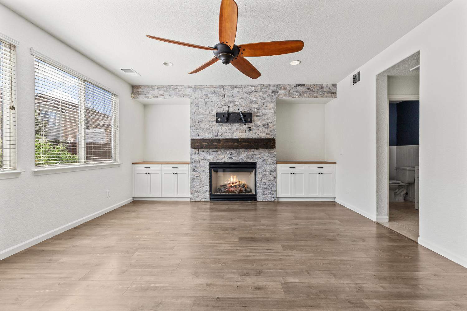 2836 Tabriz Drive Modesto, CA 95355 - Photo 16 of 35 a view of an empty room with a fireplace and a window