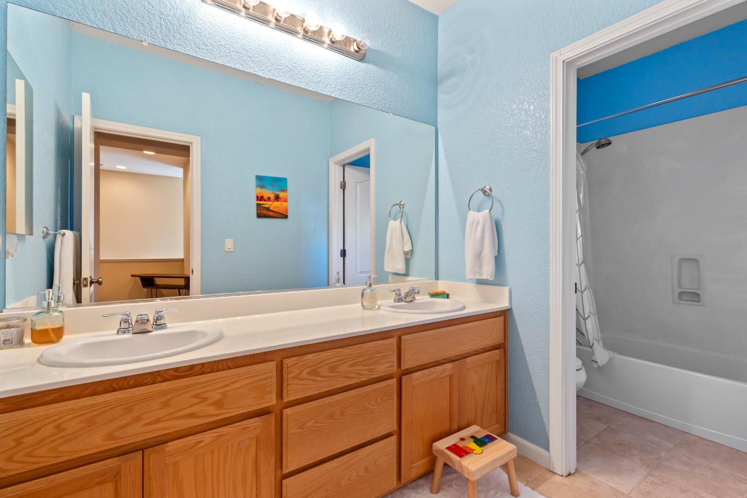 2836 Tabriz Drive Modesto, CA 95355 - Photo 22 of 35 a room with a sink and a mirror