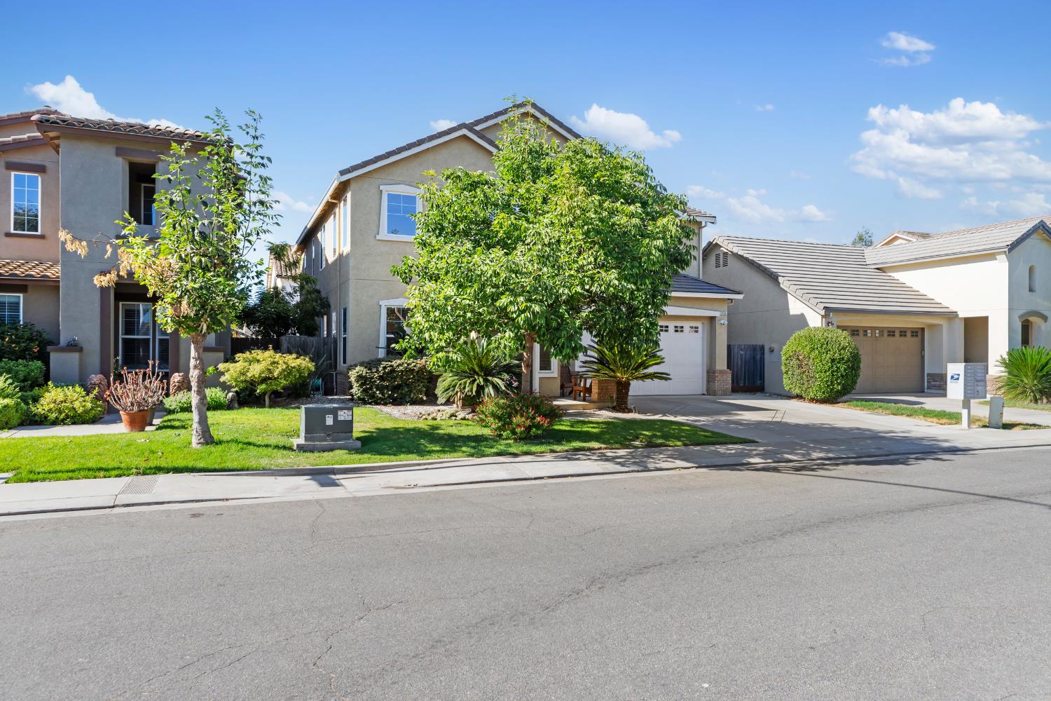 2836 Tabriz Drive Modesto, CA 95355 - Photo 35 of 35 a view of a house with a big yard plants and a large tree