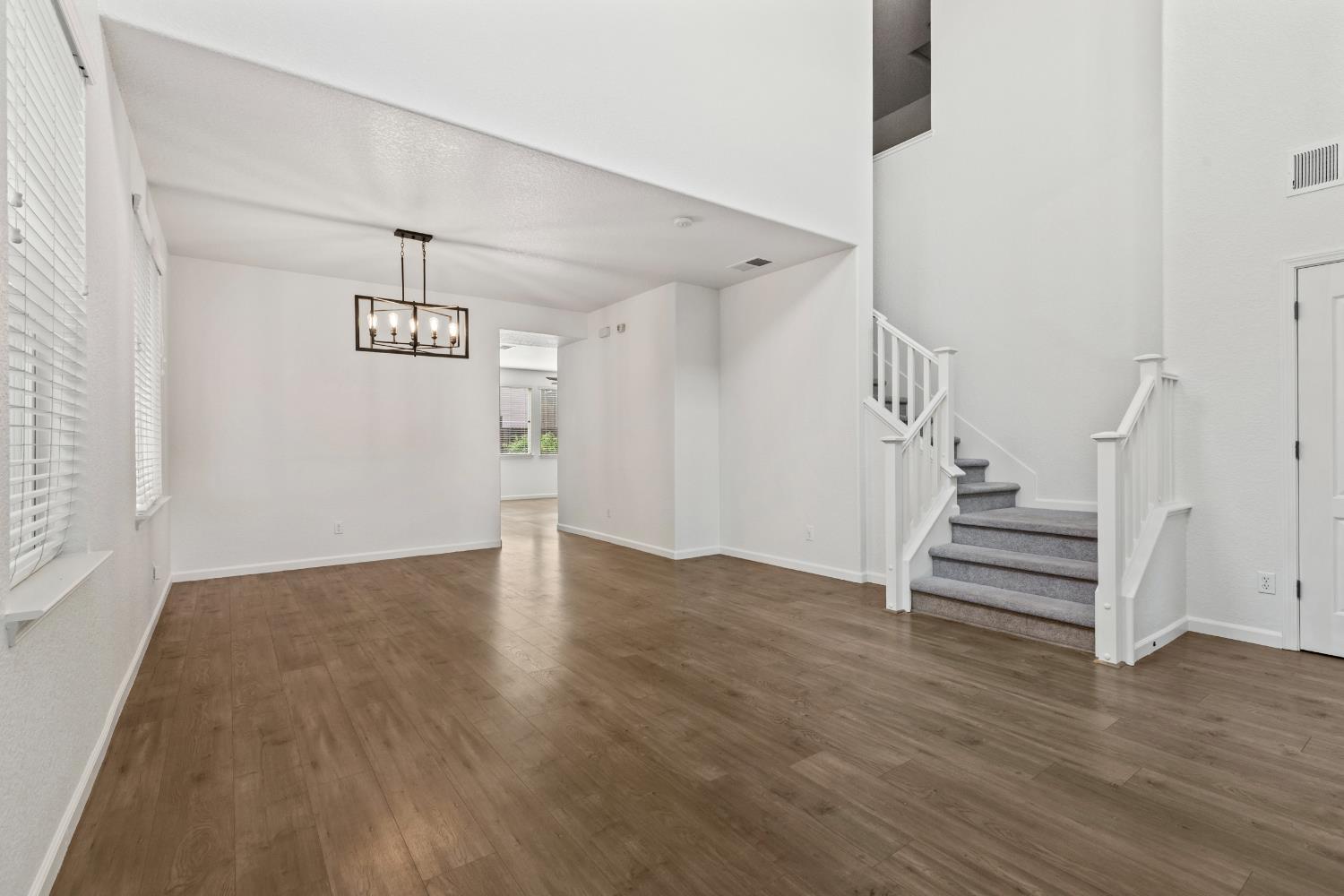 2836 Tabriz Drive Modesto, CA 95355 - Photo 5 of 35 a view of an empty room with wooden floor and a window