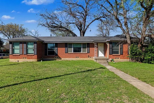 front view of a house with a yard