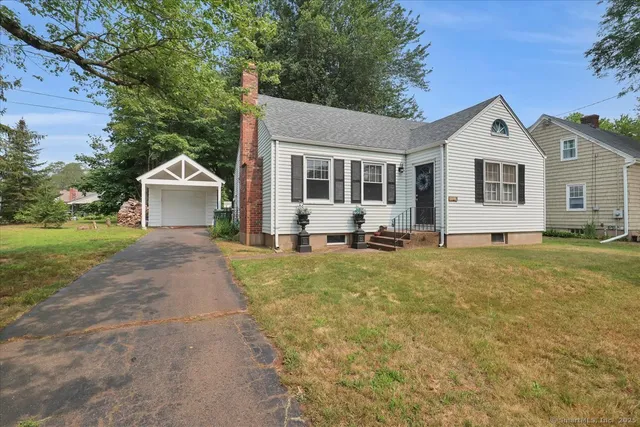 a front view of a house with yard