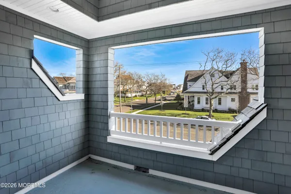 a bathroom with bathtub and window