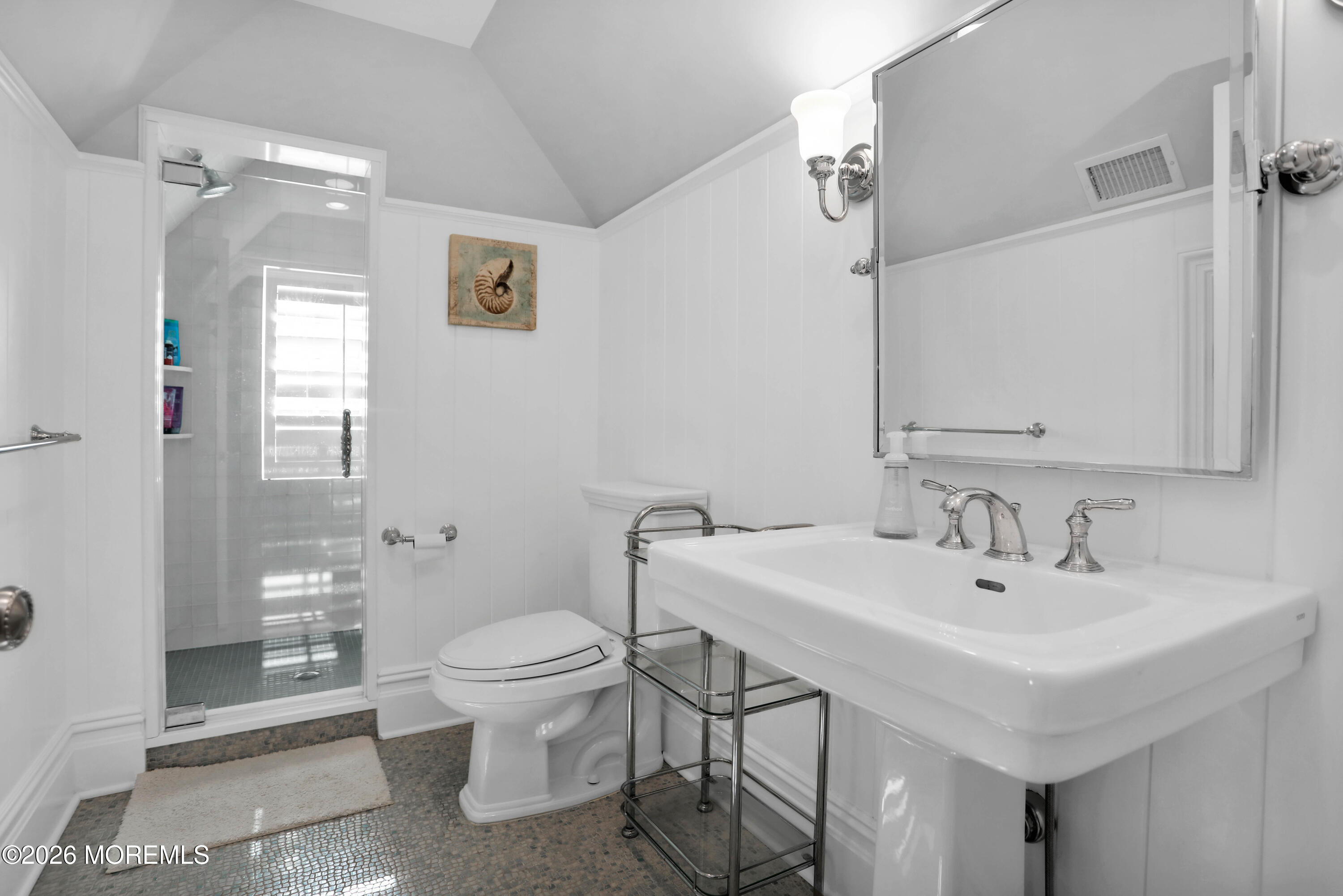 101 Tuttle Avenue Spring Lake, NJ 07762 - Photo 44 of 64 a bathroom with a toilet a sink and a mirror