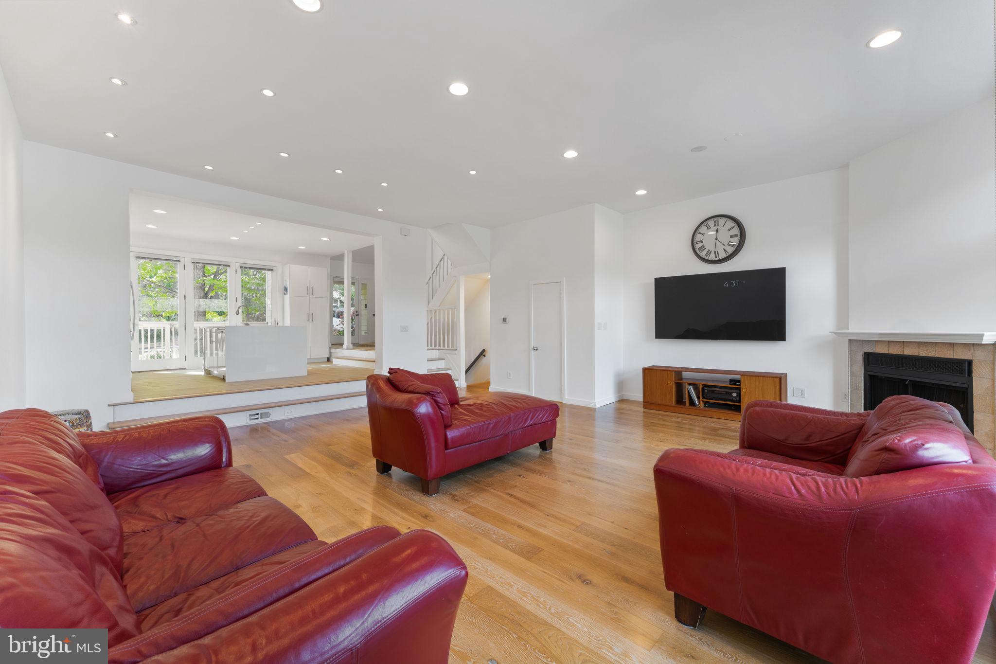 11163 Lake Chapel Lane Reston, VA 20191 - Photo 26 of 129 a living room with furniture a flat screen tv and a window