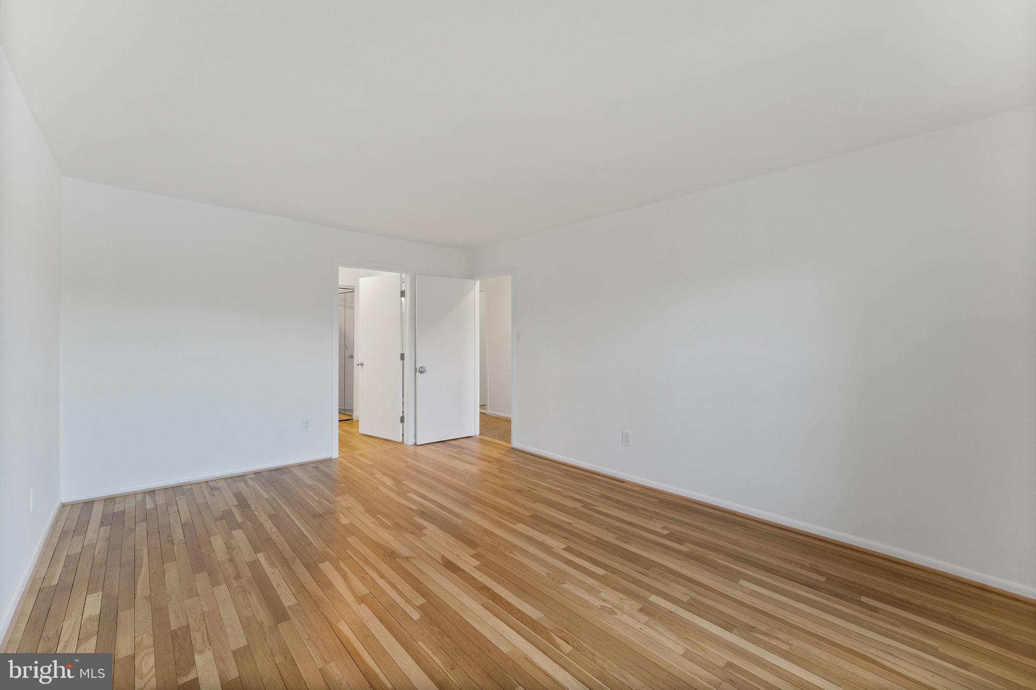 11163 Lake Chapel Lane Reston, VA 20191 - Photo 45 of 129 a view of an empty room and wooden floor