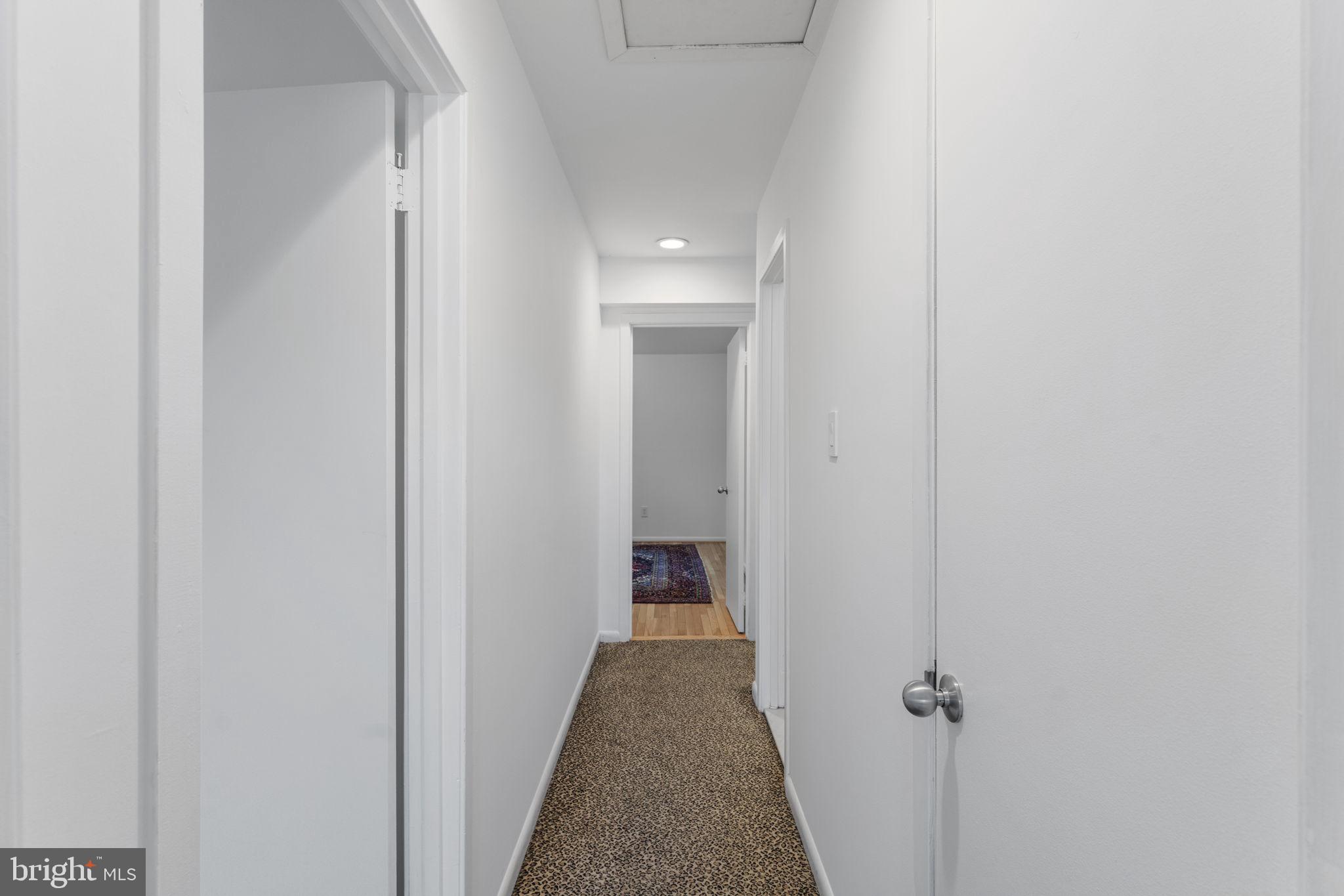 11163 Lake Chapel Lane Reston, VA 20191 - Photo 56 of 129 a view of a hallway with wooden floor and closet