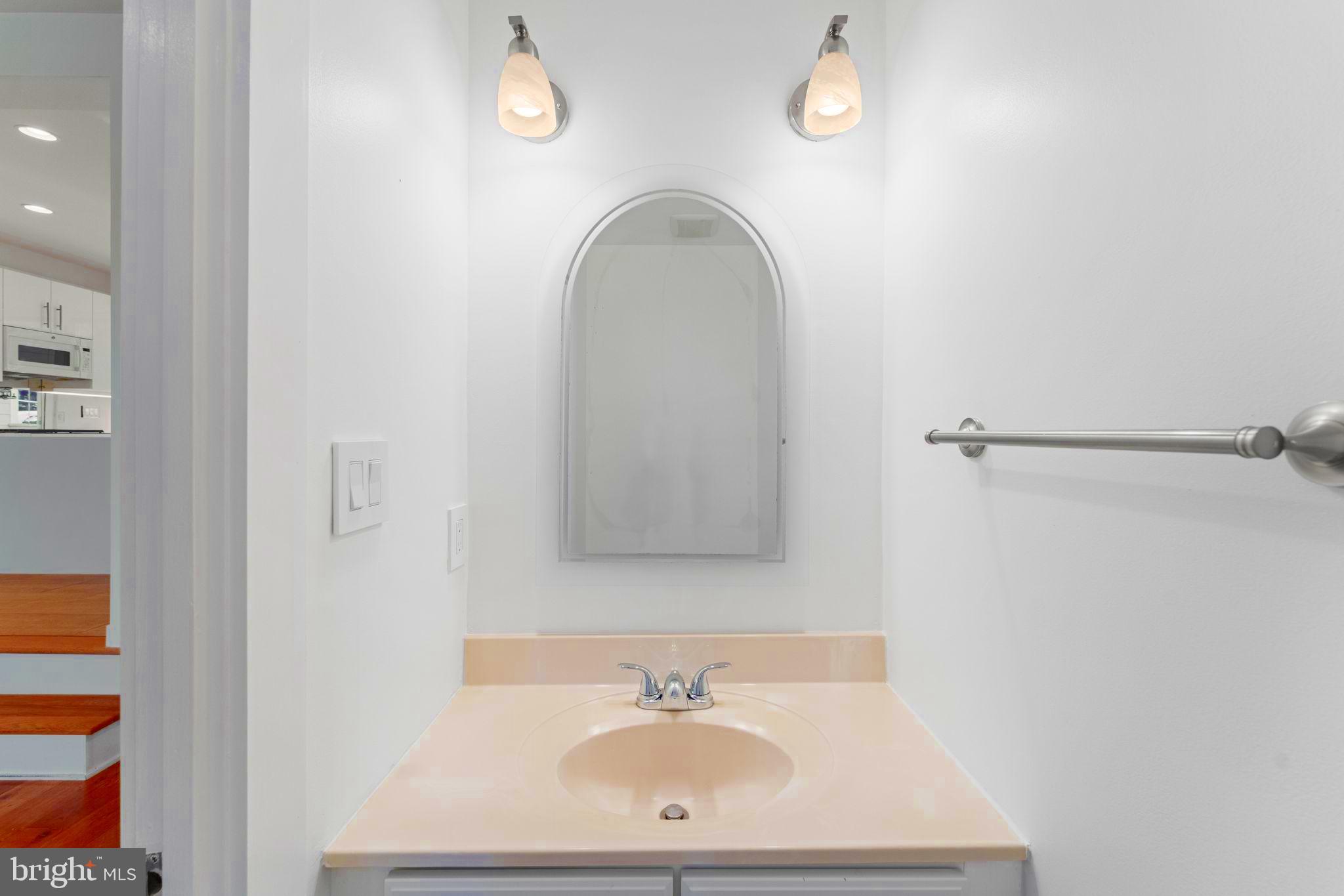 11163 Lake Chapel Lane Reston, VA 20191 - Photo 58 of 129 a bathroom with a sink a mirror and a shower