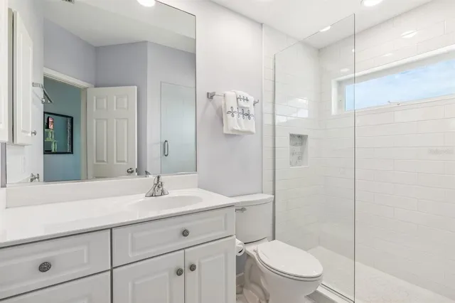 a view of a patio with table and chairs and potted plants