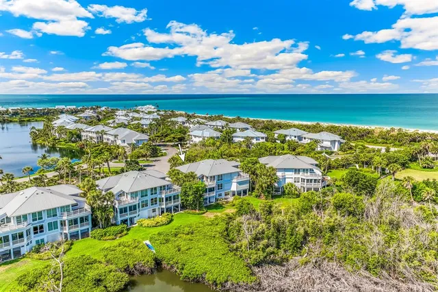 a front view of a residential apartment building with a yard