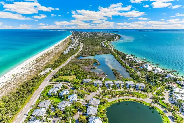 an aerial view of a house with outdoor space