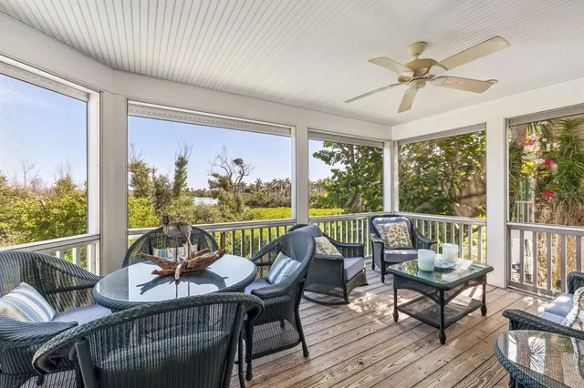 a bedroom with two beds and a chandelier