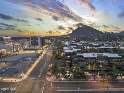 a outdoor space with the couches and dining table with the view of kitchen