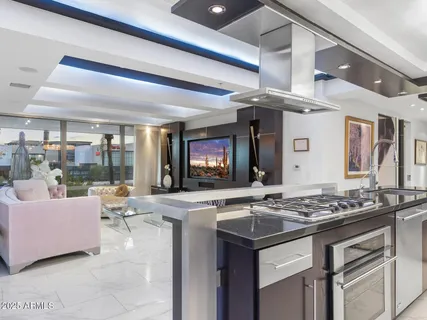 a bathroom with a glass shower door and a sink