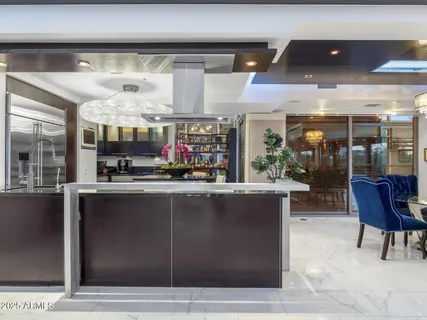 a bedroom with a bed and a chair