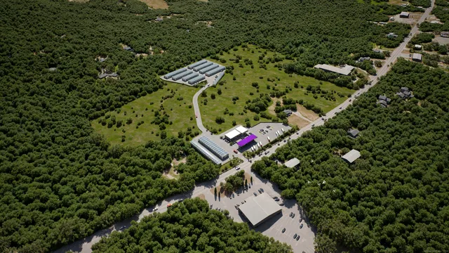 an aerial view of a house with lots of trees