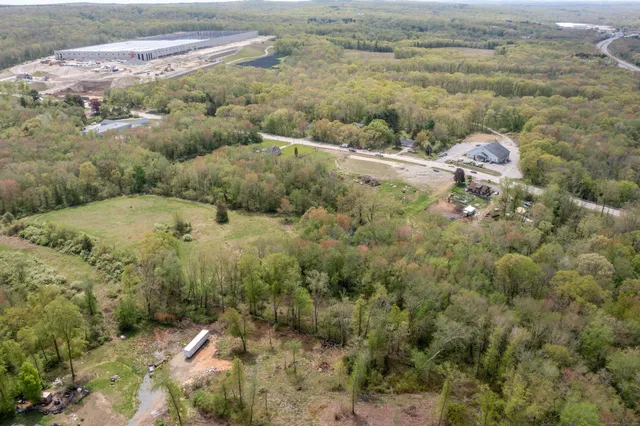 a view of a field with an ocean view