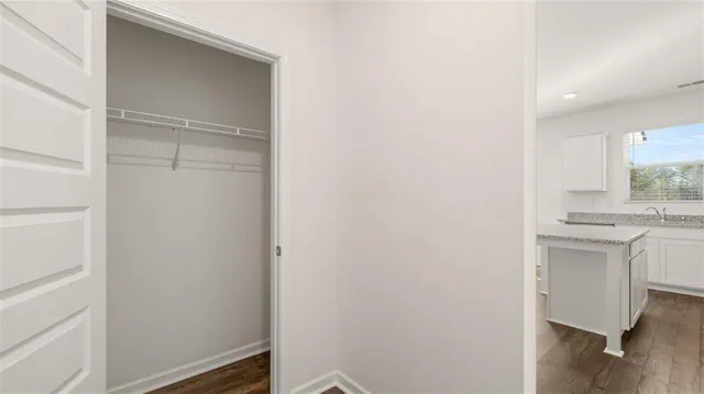 a bathroom with a sink vanity and a mirror
