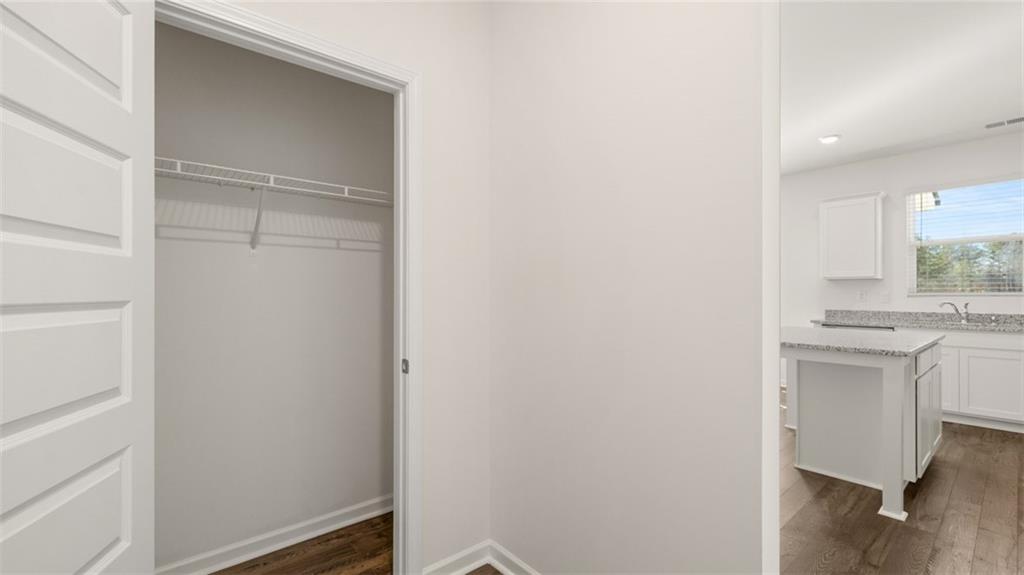 73 Weymouth Drive Locust Grove, GA 30248 - Photo 13 of 47 a bathroom with a sink vanity and a mirror