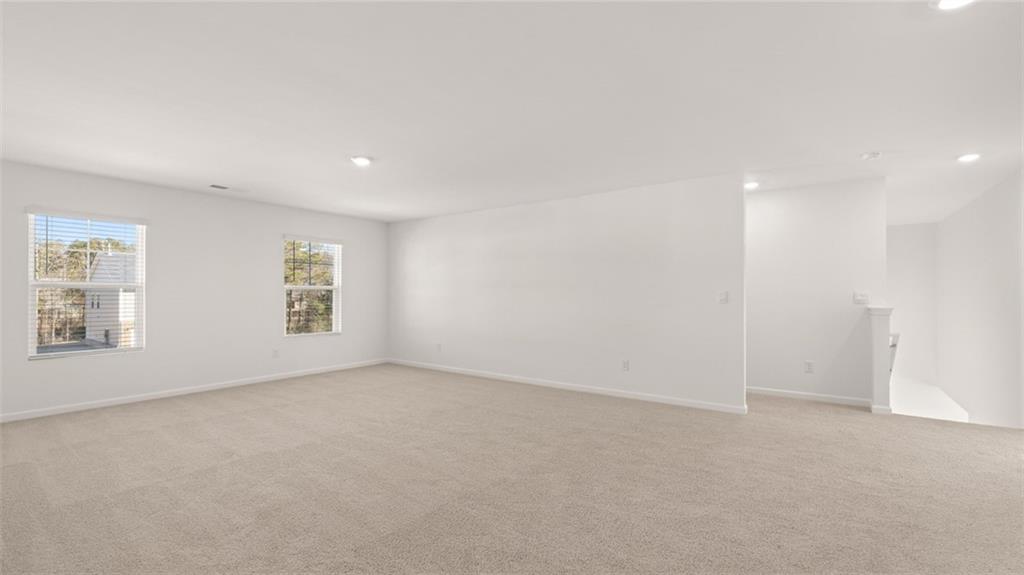 73 Weymouth Drive Locust Grove, GA 30248 - Photo 35 of 47 an empty room with windows