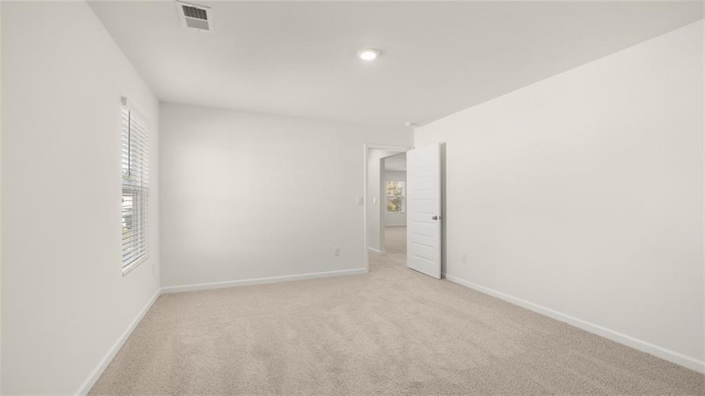 73 Weymouth Drive Locust Grove, GA 30248 - Photo 38 of 47 a view of an empty room