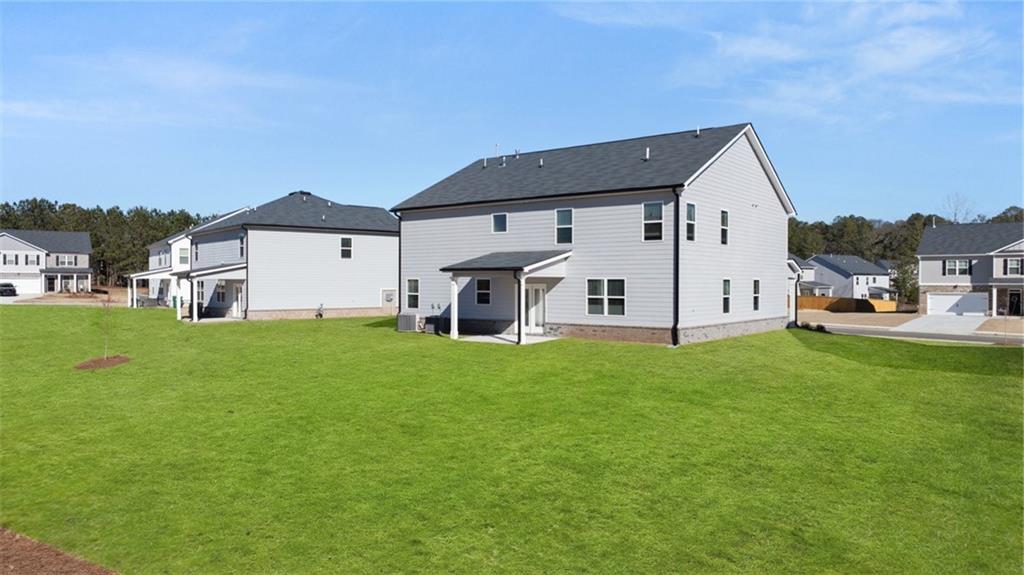 73 Weymouth Drive Locust Grove, GA 30248 - Photo 45 of 47 a view of a house with backyard