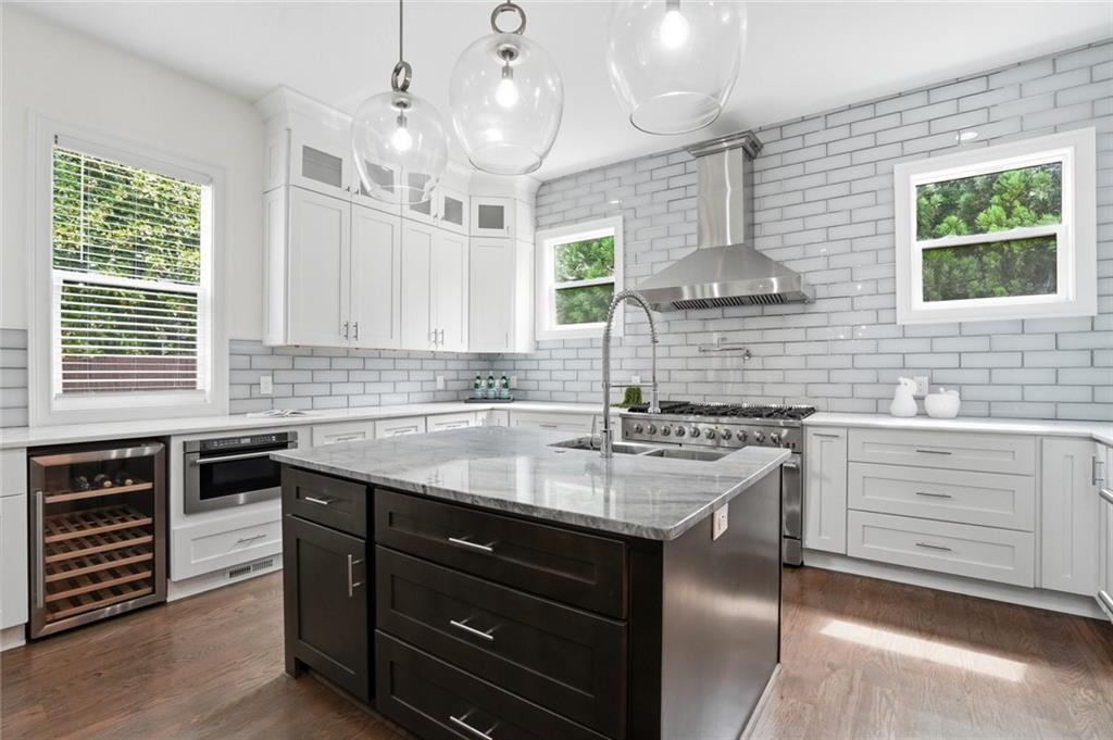 2415 West Rugby Avenue Atlanta, GA 30337 - Photo 9 of 40 a kitchen with a sink stove and window