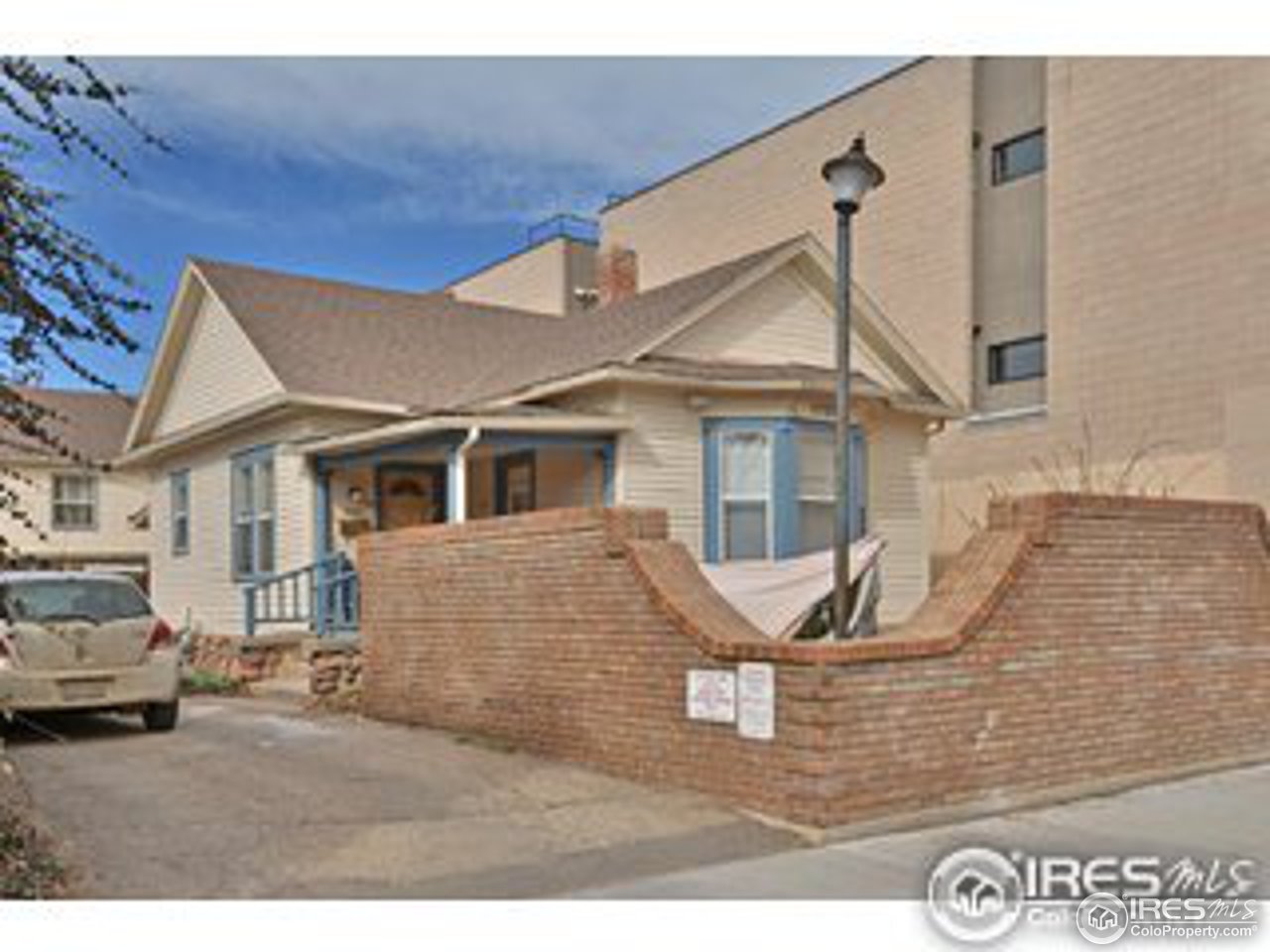 1723-1725 15th Street Boulder, CO 80302 - Photo 8 of 8 a view of a white house next to a yard