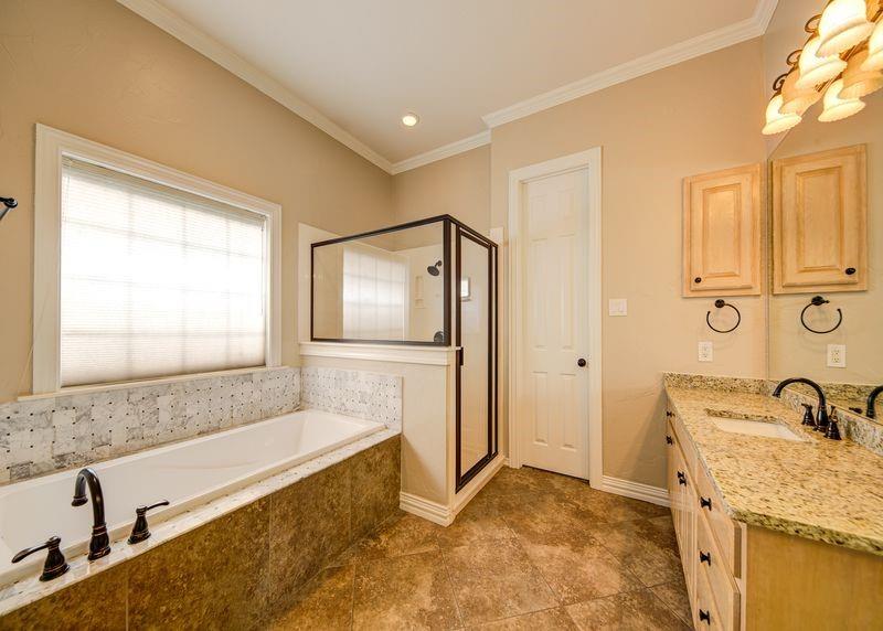 334 Farm To Market Road 2264 Decatur, TX 76234 - Photo 30 of 40 a bathroom with a granite countertop sink and a bathtub